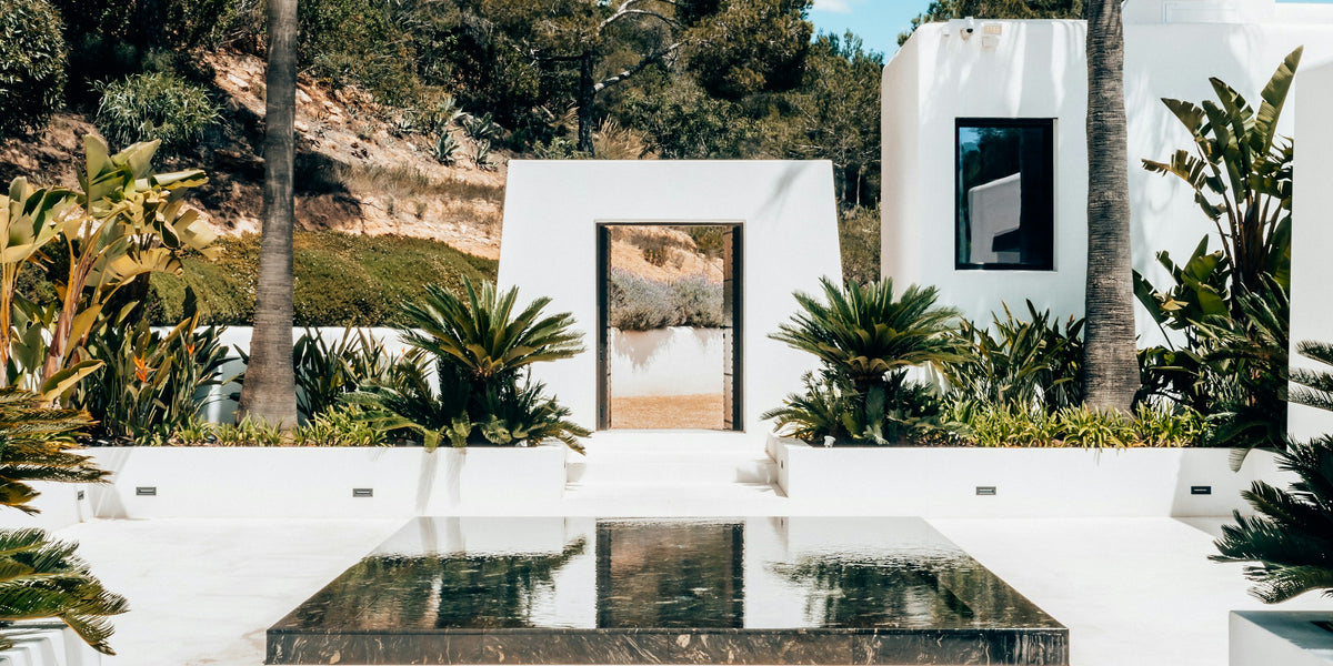 White villa with reflecting pool