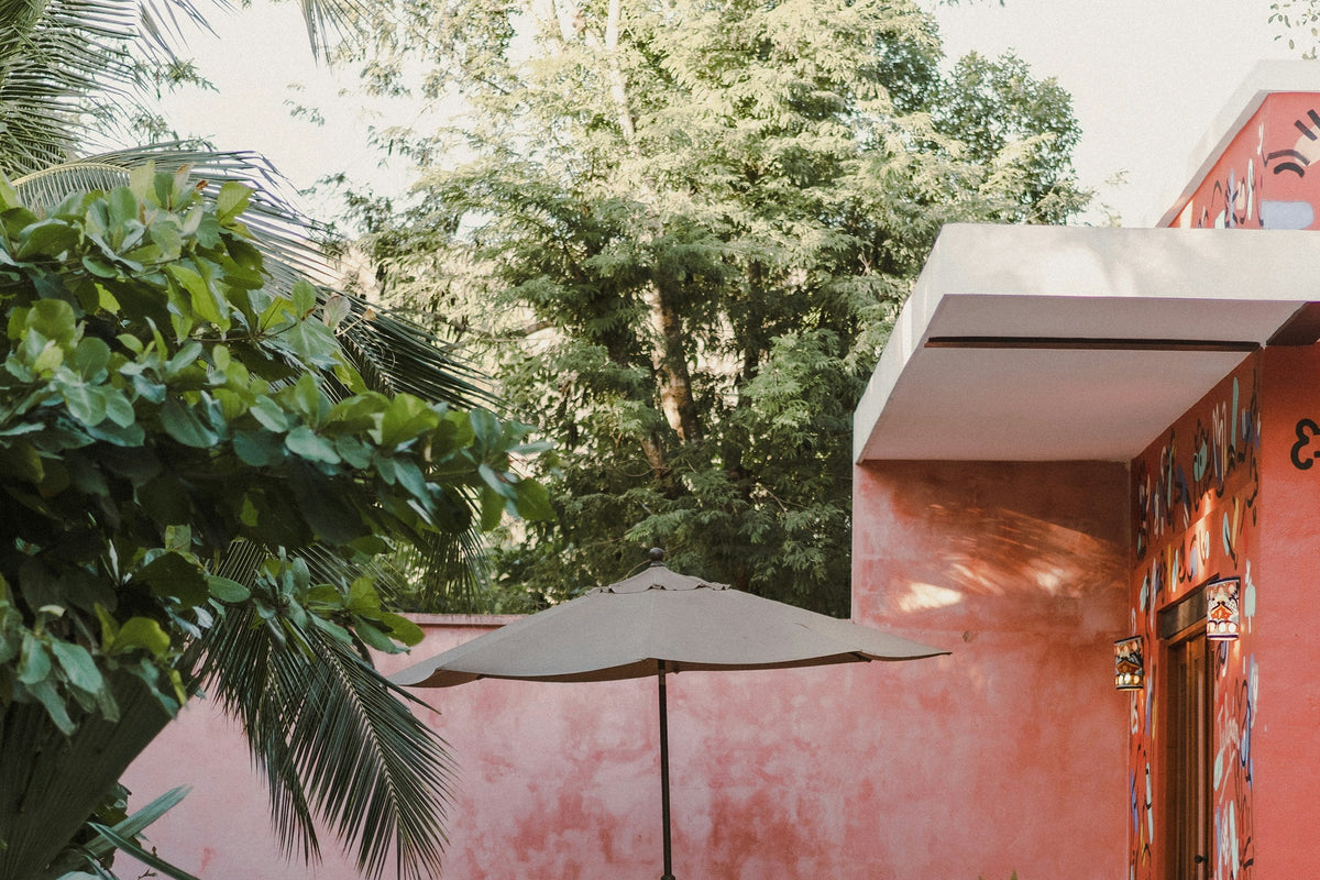 Terracotta courtyard with pool and parasol, Muladhara retreat